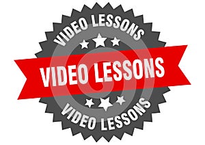 video lessons sign. video lessons round isolated ribbon label.