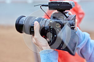 Video Making with the stabilizer. Man recording a video with a slr camcoder.