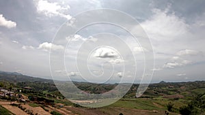 The Video moves from left to the right side of  the mountains and the town  Background beautiful clouds in the sky at Khao Kho ,