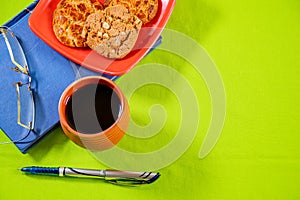 For video or movie productions, I arranged a diary or notepad, a pen, spectacles, some cookie biscuits, and a cup of black tea