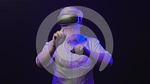 Video of an old albino grandfather putting on a new vr set and making different hand gestures, isolated on a unique background