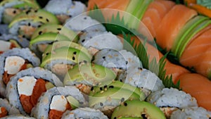 Video panning of a platter of delicious and fresh sushi rolls prepared with both raw and cooked ingredients 1080 HD