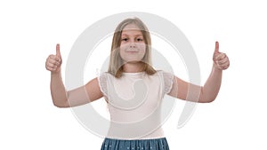 Video portrait of a pretty smiling girl holding thumbs up isolated on white background.