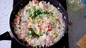 Video recipe for cooking fried rice with bacon and egg. Step 4.