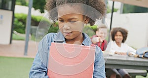 Video of sad biracial schoolgirl being taunted by two boys in schoolyard