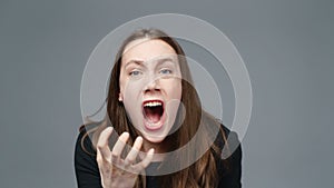 Video of screaming girl in black shirt, close-up