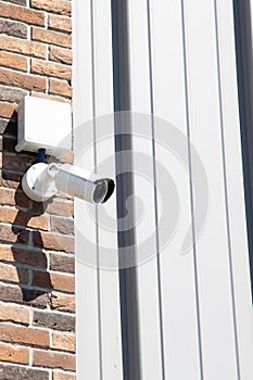 Video Security Camera Housing Mounted High in building