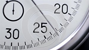 Video showing close-up Stopwatch. Clock on a dark background