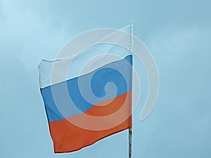 The video shows a Russian flag on the sky background.