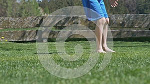 Video shows a young boy kicking a soccerball barfoot