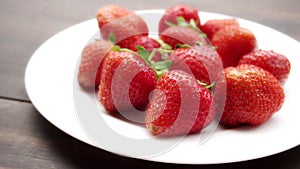 Video of spring strawberries on the table.