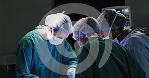 Video of three diverse female surgeons operating on patient in operating theatre