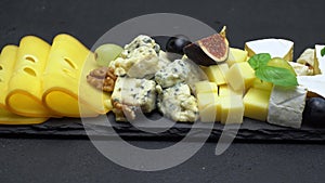 Video of various types of cheese - brie, cheddar, dorblu, parmesan