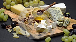 Video of various types of cheese - parmesan, brie, cheddar and roquefort