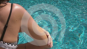 Video of a Woman Applying Sun Cream at the swimming pool
