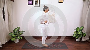 Video of woman performing Janu Shakti Vikasaka kriya