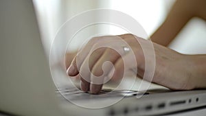 Video of a woman typing at notebook