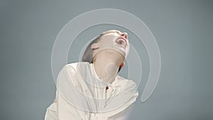 Video of young woman in straitjacket