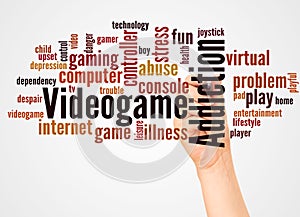 Videogame addiction word cloud and hand with marker concept