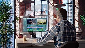 Videographer doing video montage using specialized software