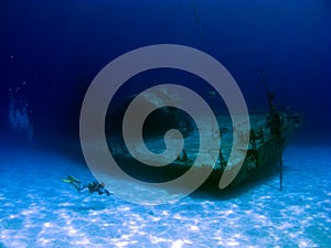 Videographer filming a sunken Shipwreck