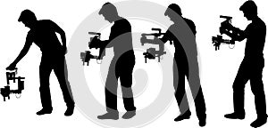 Videographer with handheld steadycam silhouettes