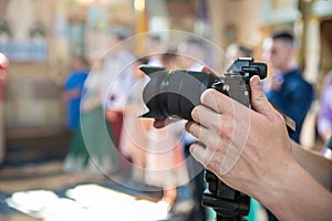 Videographer at work, filming ceremonial events in the church