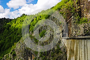 Vidraru Dam is a dam in Romania. It was completed in 1966 on the Arge River and creates Lake Vidraru. The arch dam was built with