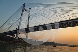 Vidyasagar setu bridge as seen from a boat on river Hooghly at twilight. Kolkata, India.