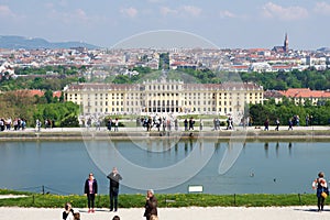 VIENNA, AUSTRIA - APR 30th, 2017: Classic view of famous Schonbrunn Palace with Great Parterre garden with people