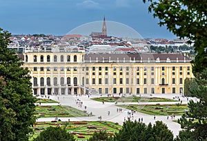 Vienna, Austria, August 20, 2022. Enchanting aerial view of the gardens of the SchÃÂ¶nbrunn Palace. The green treetops frame the photo