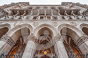 Vienna, Austria - Feb 7, 2020: Upward view of city hall facade porch with columns in winter hour