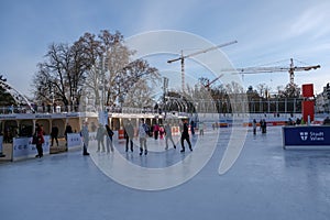 Vienna, Austria - February 18, 2021: Ice skating in front of the Vienna Town Hall.