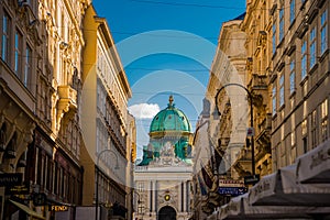 Vienna, Austria: Hofburg palace and panoramic square view, people walking and fiaker with white horses in Vienna, Austria