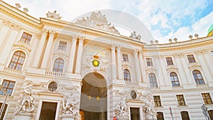 Vienna, Austria. Hofburg Palace seen from Michaelerplatz, Habsburg Empire historic landmark. Imperial Exterior Facade in center of photo