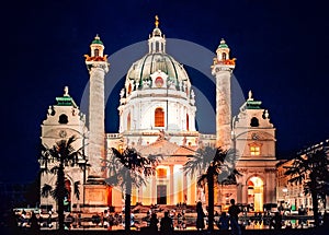 Vienna, Austria. Peoples silhouette at  Karlskirche Dome by night