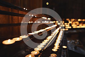 Vienna, Austria. rows of lit candles in the church.