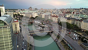 Vienna city canal riverside beach traffic bridge bay. Flying above Danube River