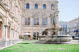 Vienna Opera house, Austria. Photo view on fountain at vienna opera state house.