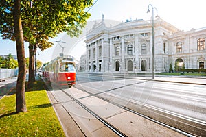 Vienna tram with Burgtheater at sunrise, Vienna, Austria