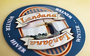 Closeup of traditional dutch country Landana cheese logo lettering with windmill