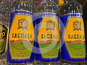 View on isolated bottle labels of brasilian Don Diego cachaca in shelf of german supermarket