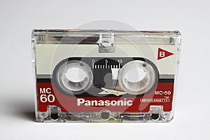 Close up of isolated old magnetic tape audio cassette, white background