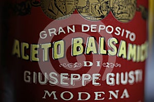Closeup of italian bottle label red aceto balsamico vinegar