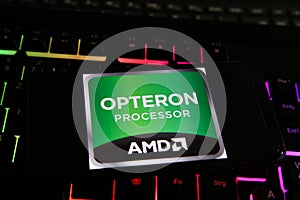 Closeup of smartphone with logo lettering of amd opteron processor cpu on computer keyboard