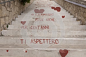 Vieste, Foggia, view of the stairs of love. Historic center, huge white stairs with red hearts of passion