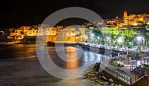 Vieste at night, the famous `Pearl of Gargano` in Foggia Province, Puglia, southern Italy.
