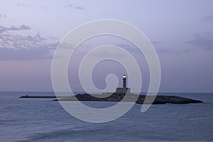 Vieste, view of the island and the lighthouse at sunset