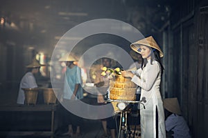 VIETNAM Beautiful women in Ao Dai Vietnam Traditional dress In market