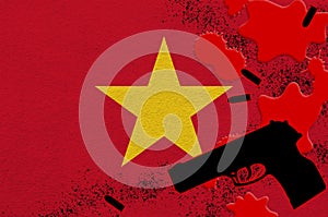 Vietnam flag and black firearm in red blood. Concept for terror attack or military operations with lethal outcome